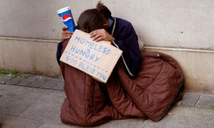A homeless person begging